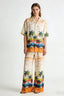 Tropical palm-tree sunset print two-piece set with short-sleeve shirt and wide-leg pants
