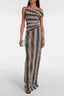 Model in a multicolor chevron-knit one-shoulder sleeveless bodycon maxi gown for evening