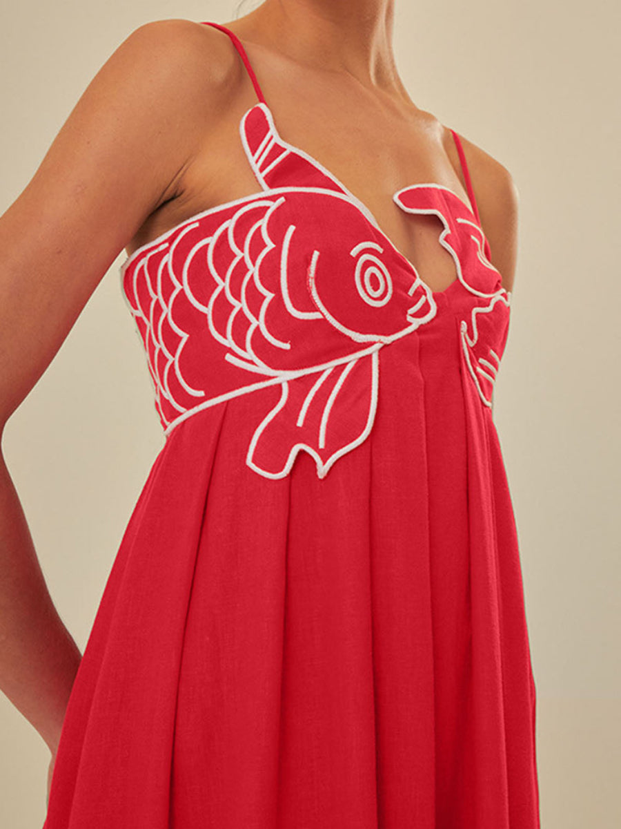 Red pleated camisole dress featuring a fish-shaped 3D embroidered bodice.