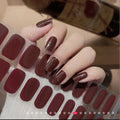 Glossy burgundy wine gel nail polish strips applied to squoval-shaped nails