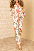 Cream scarf-print long-sleeve shirt and matching straight pants two-piece set with pink-orange trim