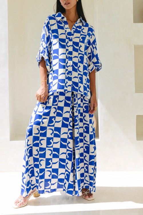 Cobalt-blue and white abstract-print linen shirt with matching wide-leg pants set