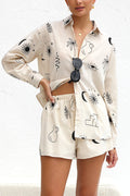 Model in a cream linen long-sleeve shirt and shorts set with a black abstract doodle print