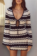 Black striped long-sleeve cutout beach cover-up with V-neck worn over a bikini