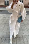 White calf-length coat with voluminous lantern sleeves and a large lapel in a loose fit