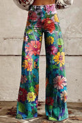 Wide-leg denim jeans in a colorful painterly floral print of zinnias and daisies