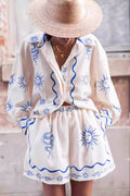 Cream linen-blend shorts set with a hand-drawn blue sun face and snake print