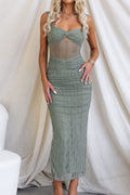 Model in sage ruched bodycon maxi dress with sheer mesh waist insert and twist-front bust
