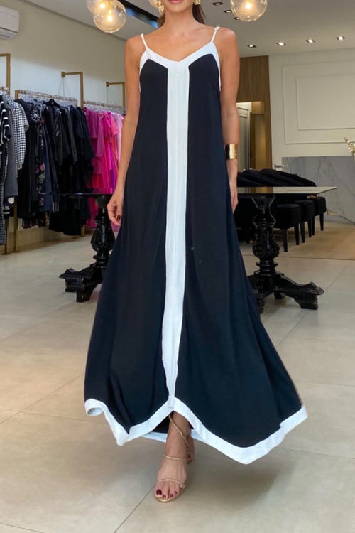 Black sleeveless V-neck maxi dress with contrast-color trim and strappy straps on model