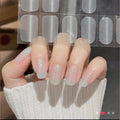 Milky white semi-cured gel nail strips with pearl shimmer in a medium squoval shape