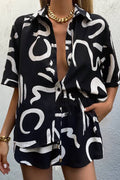 Black short-sleeve collared shirt and matching shorts two-piece set