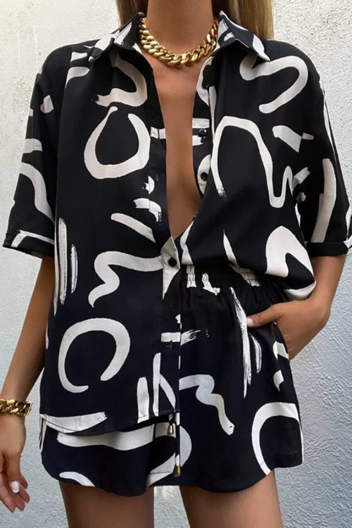 Black short-sleeve collared shirt and matching shorts two-piece set