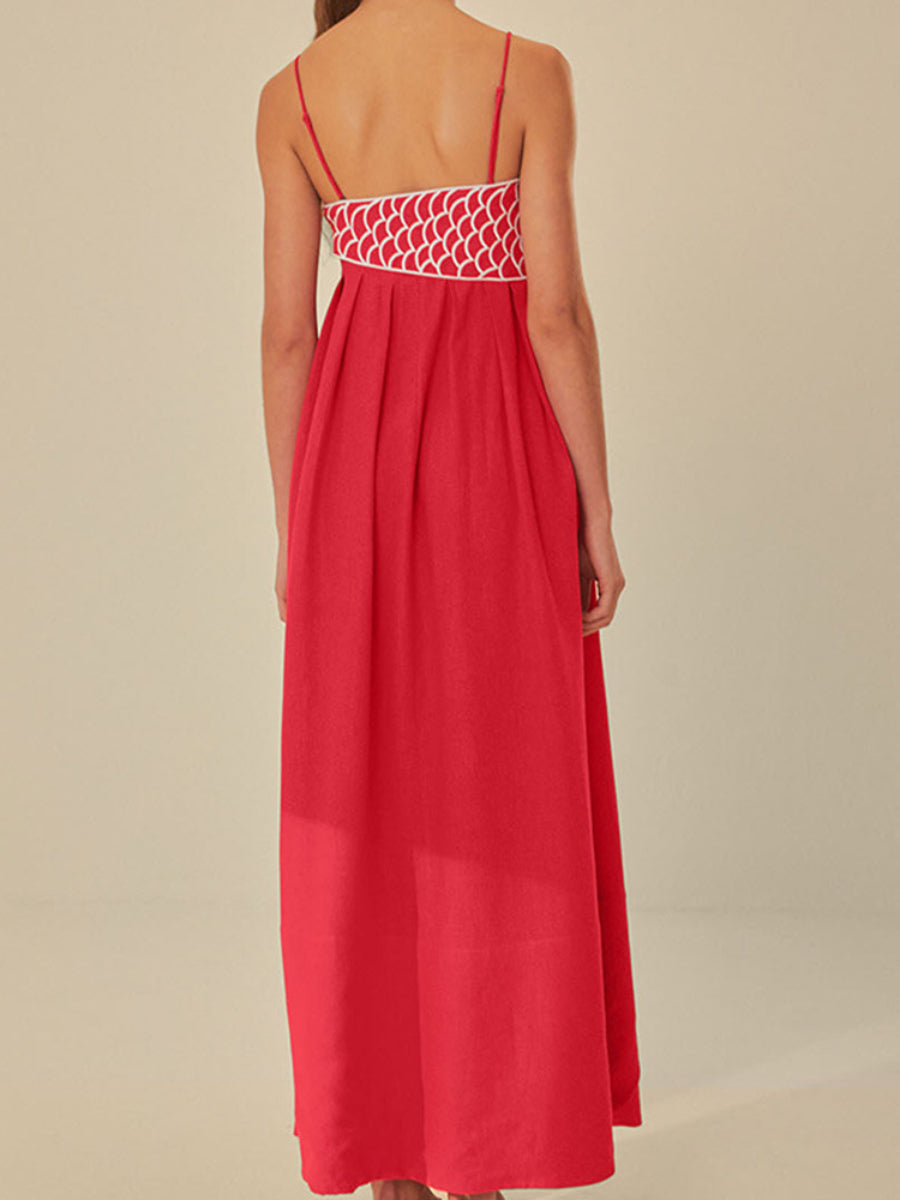Red pleated camisole dress featuring a fish-shaped 3D embroidered bodice.