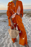 Orange linen-blend long-sleeve shirt and wide-leg pants set with white crane print