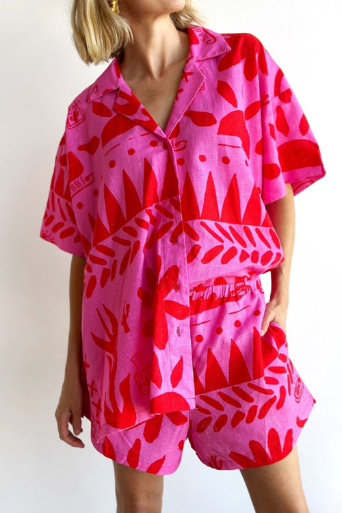 Red linen-blend two-piece set with a short-sleeve collared shirt and matching shorts
